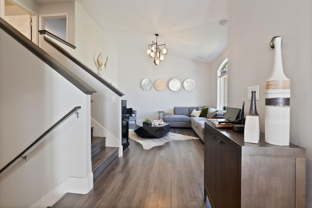 1611 W Tieton Ave, Spokane, WA 99208 - living room featuring stairs, dark wood-style floors, and a chandelier
