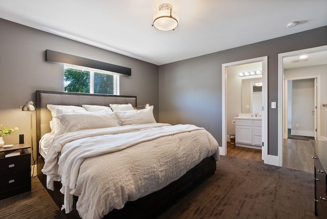 1611 W Tieton Ave, Spokane, WA 99208 - bedroom featuring dark wood-type flooring and ensuite bathroom