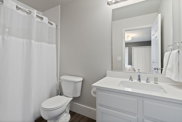 1611 W Tieton Ave, Spokane, WA 99208 - bathroom with vanity, wood finished floors, and a shower with shower curtain