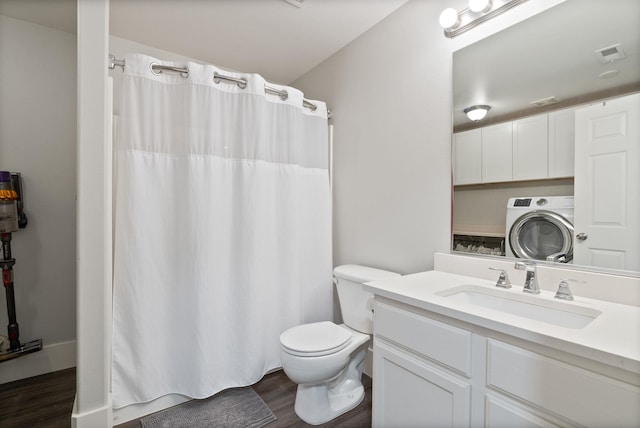 1611 W Tieton Ave, Spokane, WA 99208 - bathroom with washer / clothes dryer, wood finished floors, vanity, and a shower with shower curtain