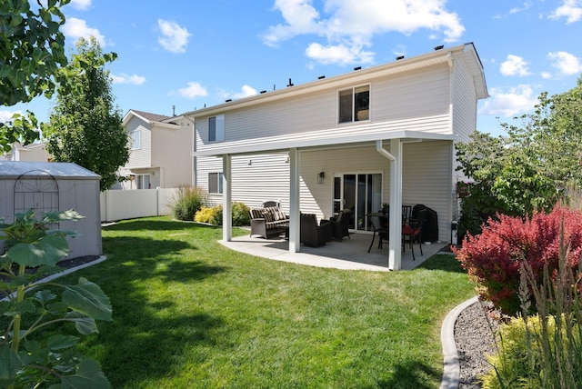 1611 W Tieton Ave, Spokane, WA 99208 - rear view of house with outdoor lounge area, a patio, and a storage unit