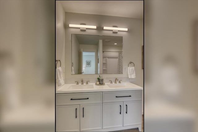 4907 E 6th Avenue 4909E 6Th Ave, Spokane Valley, WA 99212 - bathroom featuring double vanity and backsplash