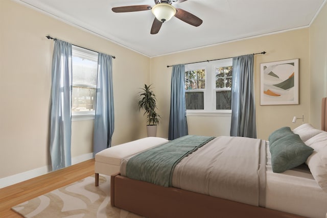 19 E 28th Ave, Spokane, WA 99203 - bedroom with wood finished floors, multiple windows, a ceiling fan, and ornamental molding