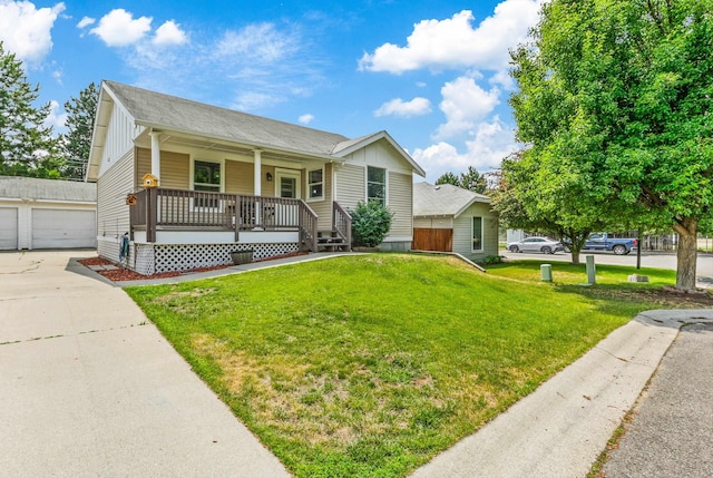 9906 E 17th Ln, Spokane Valley, WA 99206 - view of front of house with covered porch, board and batten siding, a front lawn, an outbuilding, and a shingled roof