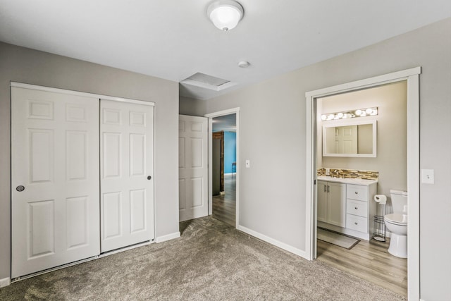 9906 E 17th Ln, Spokane Valley, WA 99206 - unfurnished bedroom featuring a closet, connected bathroom, carpet flooring, and attic access
