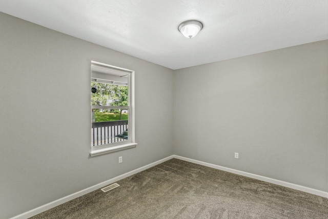 9906 E 17th Ln, Spokane Valley, WA 99206 - unfurnished room featuring dark carpet and baseboards