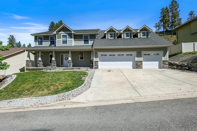 16319 E Whirlaway Ln, Veradale, WA 99037 - craftsman inspired home with stone siding, a porch, concrete driveway, an attached garage, and a shingled roof