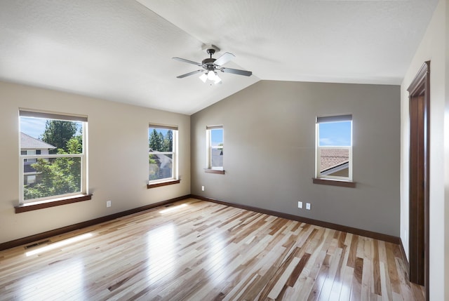 16319 E Whirlaway Ln, Veradale, WA 99037 - unfurnished bedroom with light wood-style flooring, lofted ceiling, and a ceiling fan