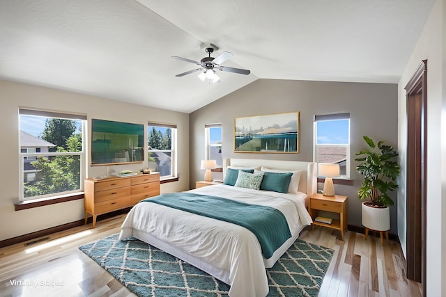 16319 E Whirlaway Ln, Veradale, WA 99037 - bedroom with lofted ceiling, light wood-type flooring, and a ceiling fan