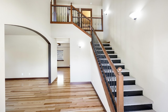 16319 E Whirlaway Ln, Veradale, WA 99037 - staircase with wood finished floors and a towering ceiling