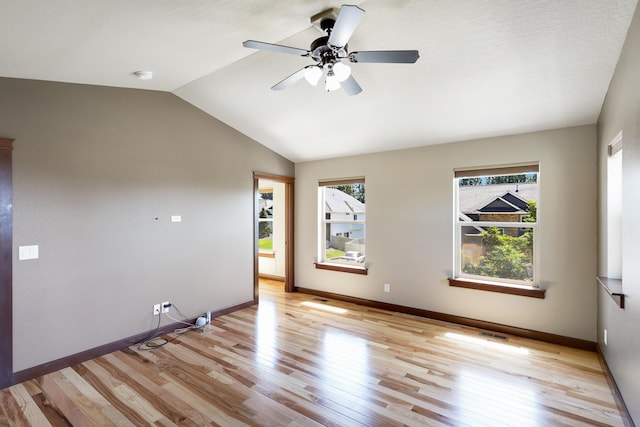 16319 E Whirlaway Ln, Veradale, WA 99037 - unfurnished room with healthy amount of natural light, light wood-style flooring, a smoke detector, and lofted ceiling