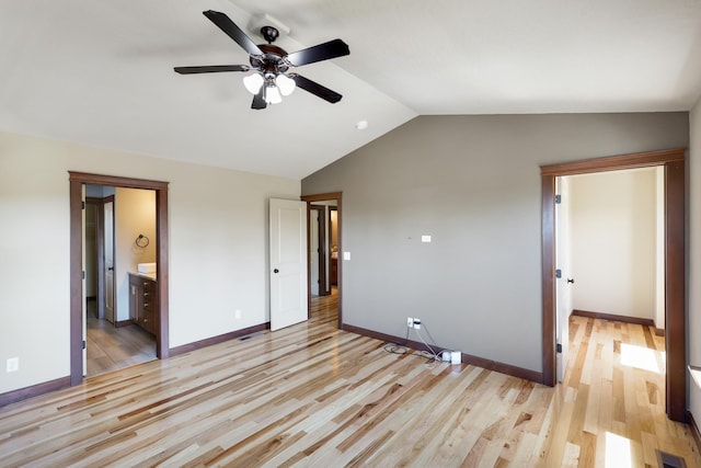 16319 E Whirlaway Ln, Veradale, WA 99037 - unfurnished bedroom featuring lofted ceiling, light wood-style flooring, ensuite bathroom, and a ceiling fan