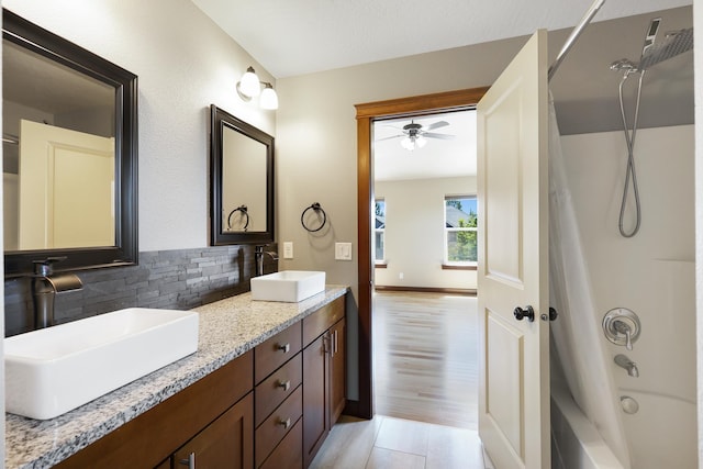 16319 E Whirlaway Ln, Veradale, WA 99037 - full bath featuring decorative backsplash, double vanity, shower / bath combo, and a ceiling fan