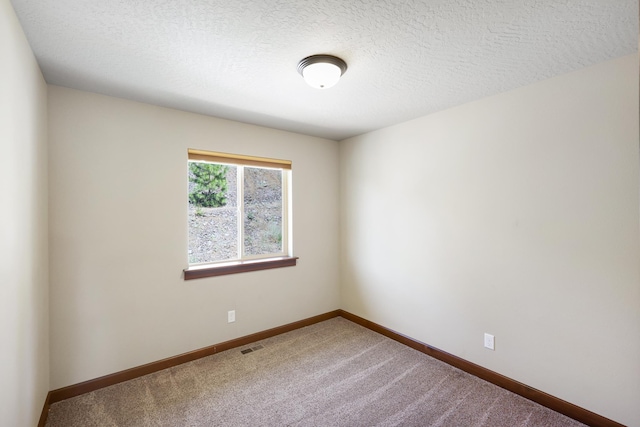 16319 E Whirlaway Ln, Veradale, WA 99037 - empty room with carpet and a textured ceiling