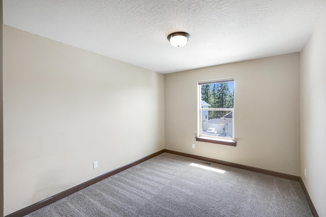 16319 E Whirlaway Ln, Veradale, WA 99037 - spare room featuring carpet and a textured ceiling