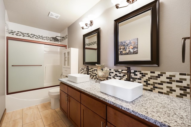 16319 E Whirlaway Ln, Veradale, WA 99037 - bathroom with shower / bathtub combination, decorative backsplash, and double vanity