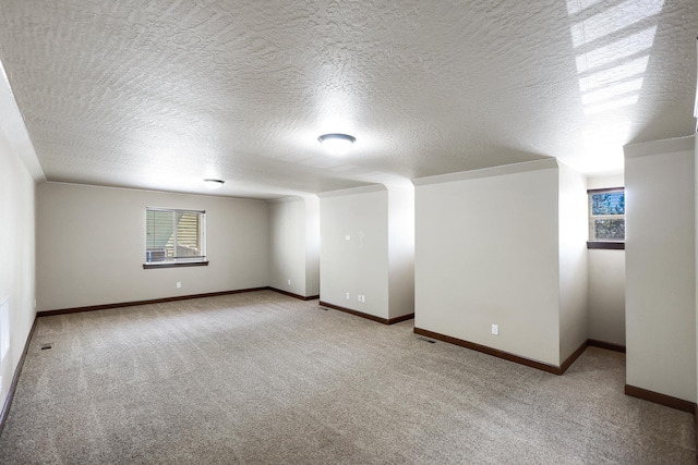 16319 E Whirlaway Ln, Veradale, WA 99037 - empty room featuring light colored carpet, healthy amount of natural light, and a textured ceiling