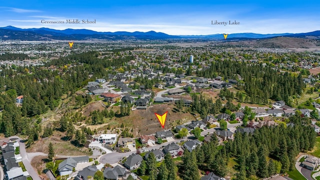 16319 E Whirlaway Ln, Veradale, WA 99037 - aerial overview of property's location featuring a mountainous background and nearby suburban area