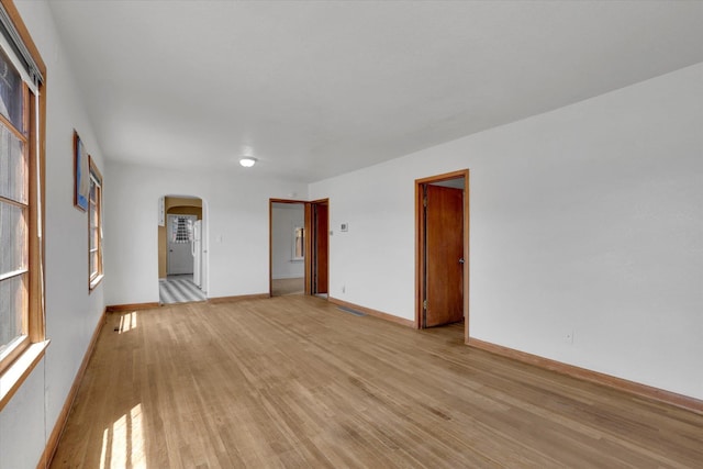 1728 W Spofford Ave, Spokane, WA 99205 - spare room with arched walkways and light wood-type flooring