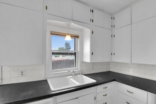 1728 W Spofford Ave, Spokane, WA 99205 - kitchen featuring white cabinets, dark countertops, and tasteful backsplash