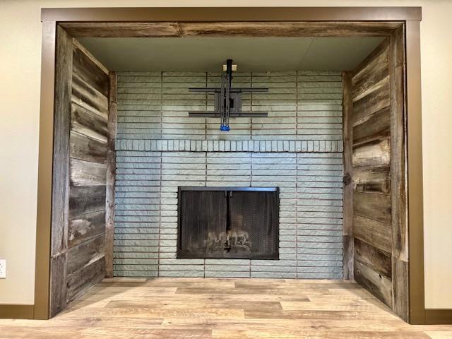 6412 N Fotheringham St, Spokane, WA 99208 - detailed view of wood finished floors and a fireplace