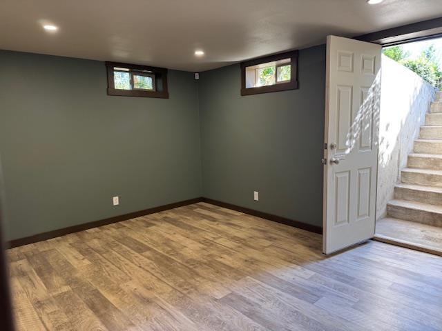 6412 N Fotheringham St, Spokane, WA 99208 - below grade area with plenty of natural light, light wood-style flooring, recessed lighting, and stairs