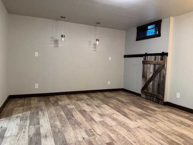 6412 N Fotheringham St, Spokane, WA 99208 - unfurnished living room featuring wood finished floors