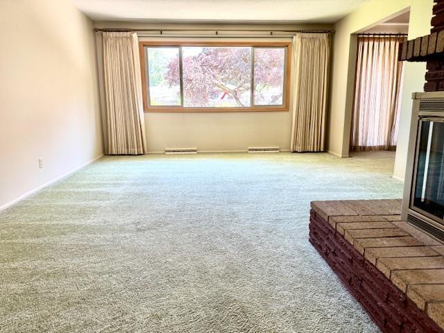 6412 N Fotheringham St, Spokane, WA 99208 - unfurnished living room featuring carpet