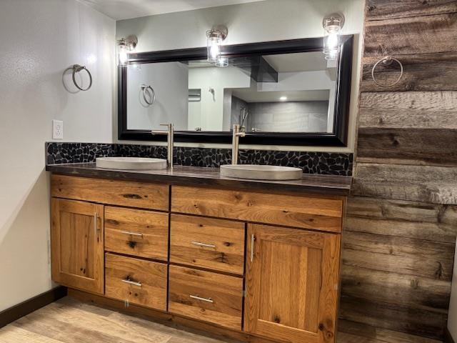 6412 N Fotheringham St, Spokane, WA 99208 - full bath featuring double vanity, wood finished floors, and tasteful backsplash