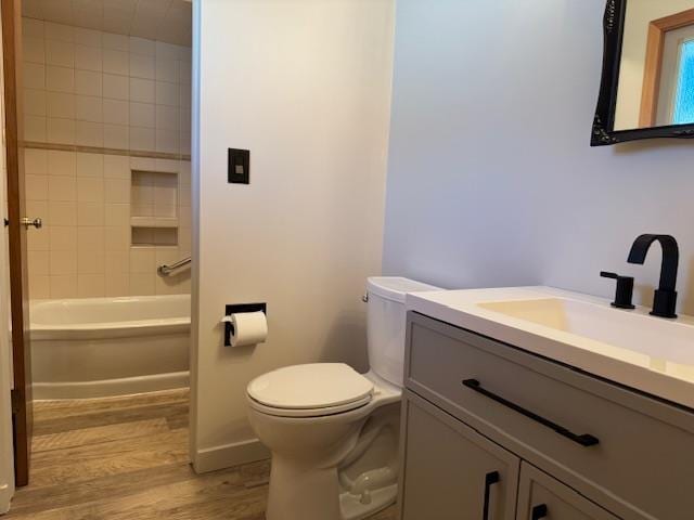 6412 N Fotheringham St, Spokane, WA 99208 - full bath featuring wood finished floors, vanity, and tub / shower combination