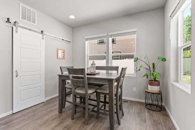 1225 E Paske Rd, Colbert, WA 99005 - dining room with a barn door, wood finished floors, and recessed lighting