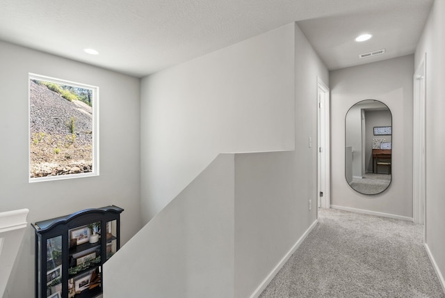 1225 E Paske Rd, Colbert, WA 99005 - corridor featuring an upstairs landing, carpet floors, recessed lighting, and arched walkways