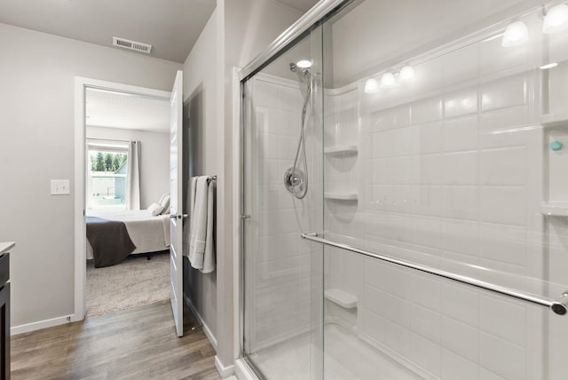 1225 E Paske Rd, Colbert, WA 99005 - ensuite bathroom featuring wood finished floors, a stall shower, and vanity