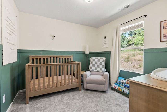 1225 E Paske Rd, Colbert, WA 99005 - bedroom featuring carpet floors, a crib, and wainscoting