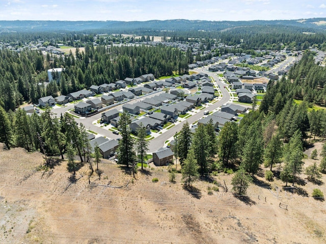 1225 E Paske Rd, Colbert, WA 99005 - aerial view of property's location featuring nearby suburban area and a forest