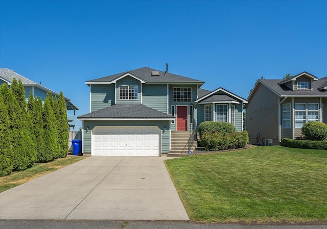 4407 E 14th Ave, Spokane, WA 99212 - view of front of home with a front lawn, driveway, and a garage