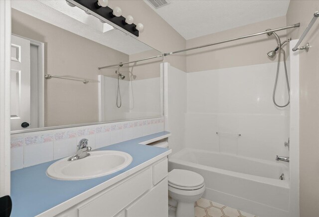 4407 E 14th Ave, Spokane, WA 99212 - full bathroom featuring washtub / shower combination, vanity, decorative backsplash, and tile patterned flooring