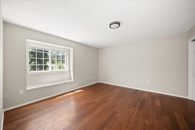 4407 E 14th Ave, Spokane, WA 99212 - empty room with wood finished floors and a textured ceiling
