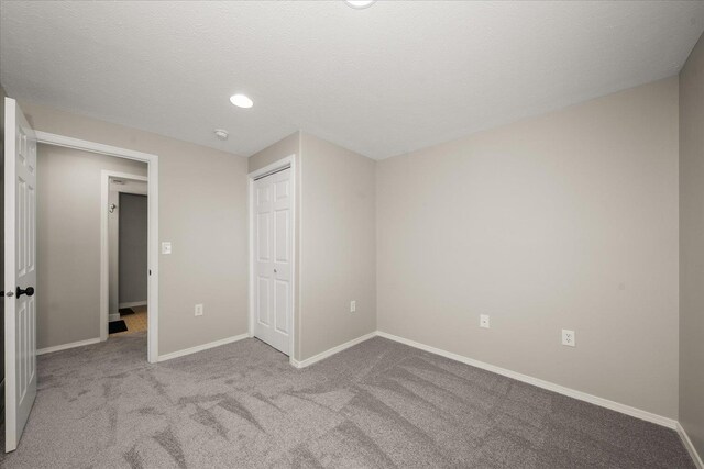 4407 E 14th Ave, Spokane, WA 99212 - unfurnished bedroom with carpet flooring, a closet, and recessed lighting