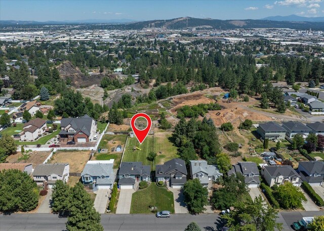 4407 E 14th Ave, Spokane, WA 99212 - aerial view of property's location with nearby suburban area and mountains