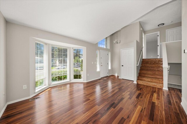 4407 E 14th Ave, Spokane, WA 99212 - unfurnished living room featuring plenty of natural light, wood finished floors, and stairs