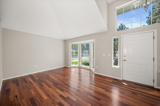4407 E 14th Ave, Spokane, WA 99212 - entrance foyer with dark wood-type flooring, a towering ceiling, and a chandelier
