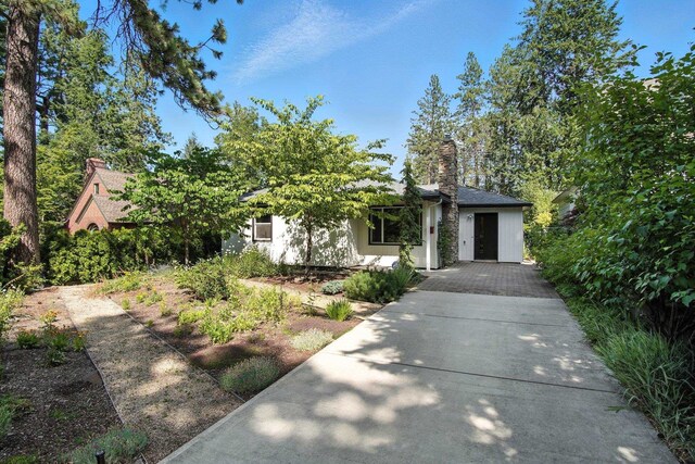 3121 S Manito Blvd, Spokane, WA 99203 - view of property hidden behind natural elements with a chimney