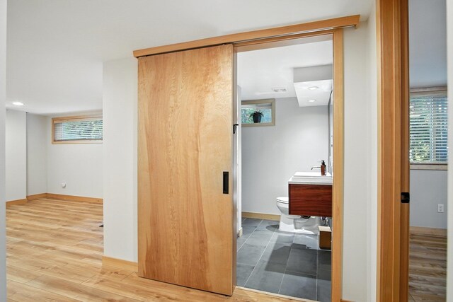 3121 S Manito Blvd, Spokane, WA 99203 - corridor with healthy amount of natural light, wood finished floors, and recessed lighting
