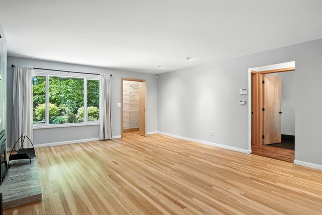 3121 S Manito Blvd, Spokane, WA 99203 - unfurnished living room featuring baseboards and light wood-type flooring