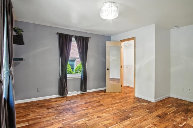3121 S Manito Blvd, Spokane, WA 99203 - spare room featuring light wood-style floors and a chandelier