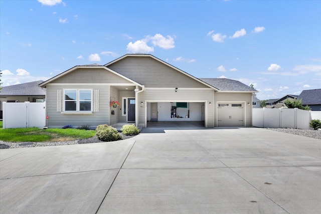 8812 W Pirates Ct, Spokane, WA 99224 - view of front facade with driveway and an attached garage