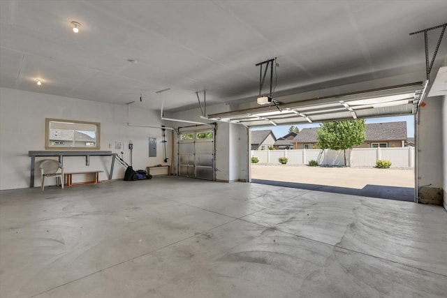 8812 W Pirates Ct, Spokane, WA 99224 - garage with a garage door opener and electric panel