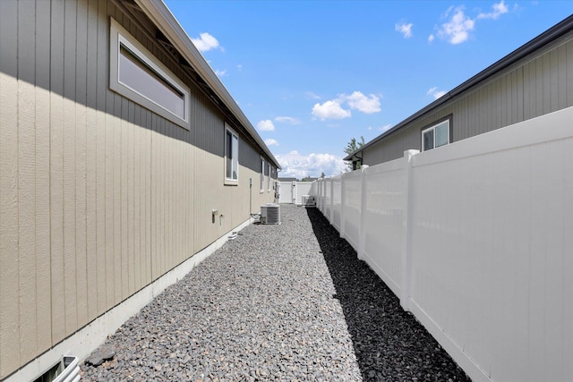 8812 W Pirates Ct, Spokane, WA 99224 - view of home's exterior with a fenced backyard and a central AC unit