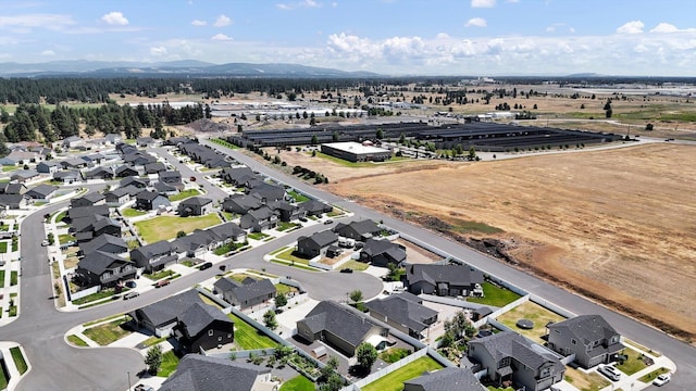 8812 W Pirates Ct, Spokane, WA 99224 - aerial view of property and surrounding area featuring nearby suburban area and mountains